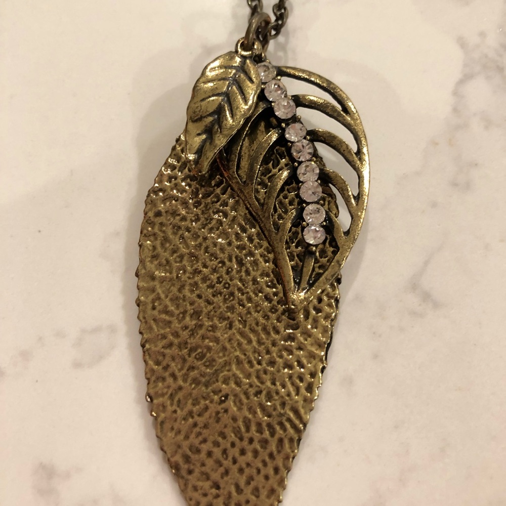 Brass colored long triple leaf necklace